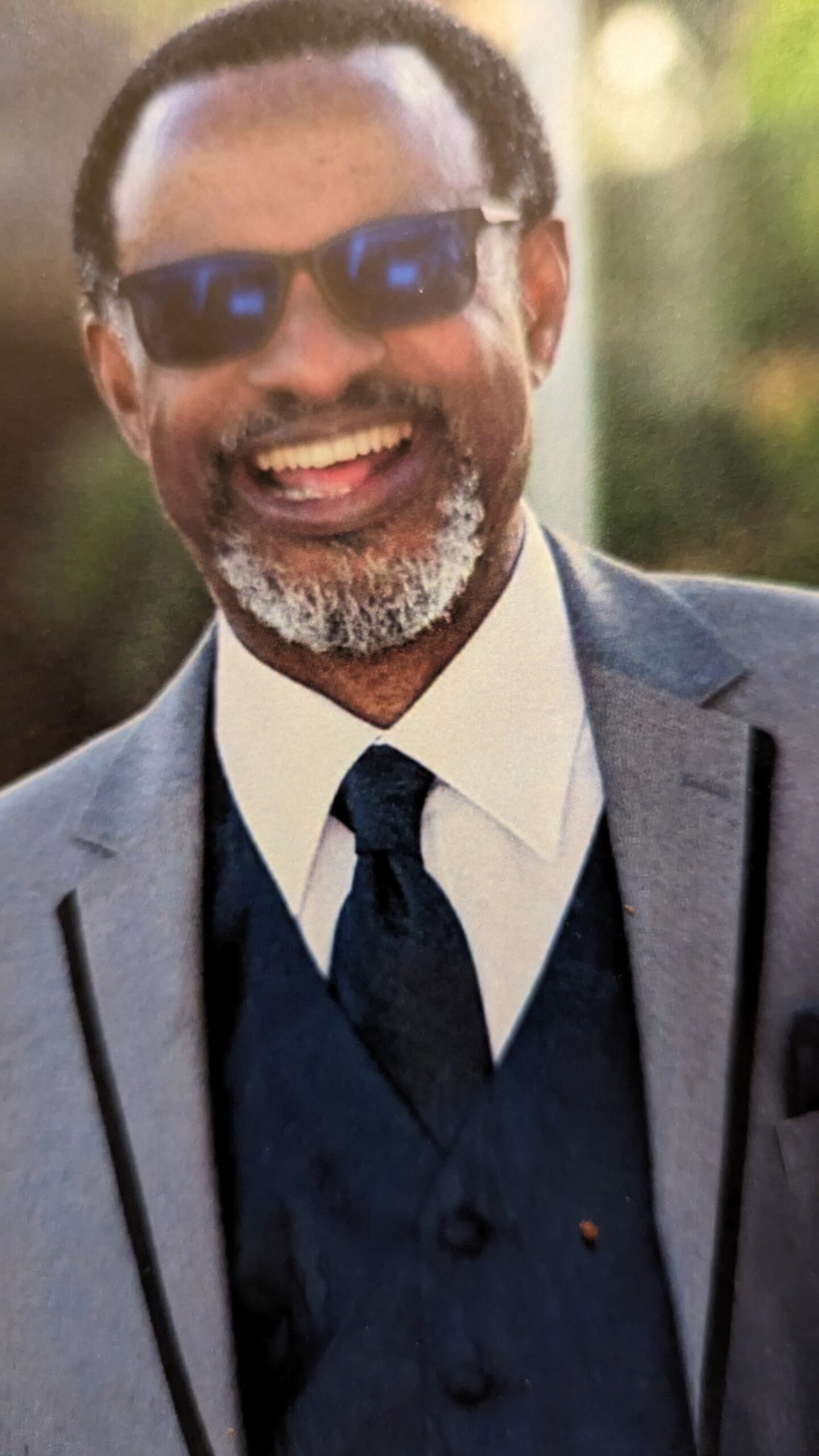 A render of three white cylindrical columns, against a warm creme background
